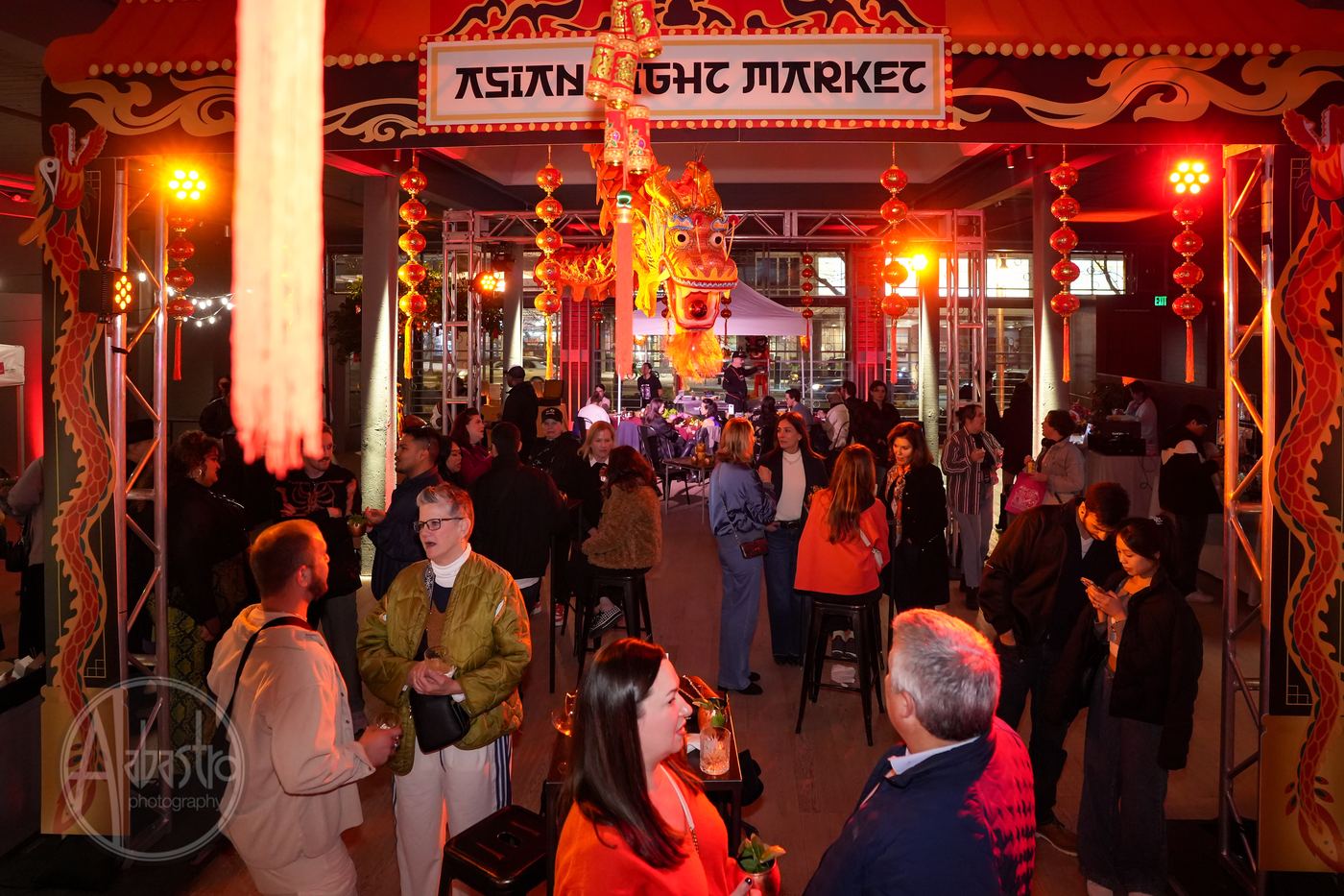 Asian Night Market themed corporate event at Palladian Arthouse with dragon installation and red lanterns